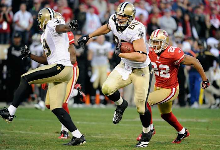 Jan 14, 2012; San Francisco, CA, USA; New Orleans Saints tight end Jimmy Graham (80) runs with the ball past San Francisco 49ers cornerback Carlos Rogers (22) during the fourth quarter of the 2011 NFC divisional playoff game at Candlestick Park. The 49ers defeated the Saints 36-32. Mandatory Credit: Kyle Terada-USA TODAY